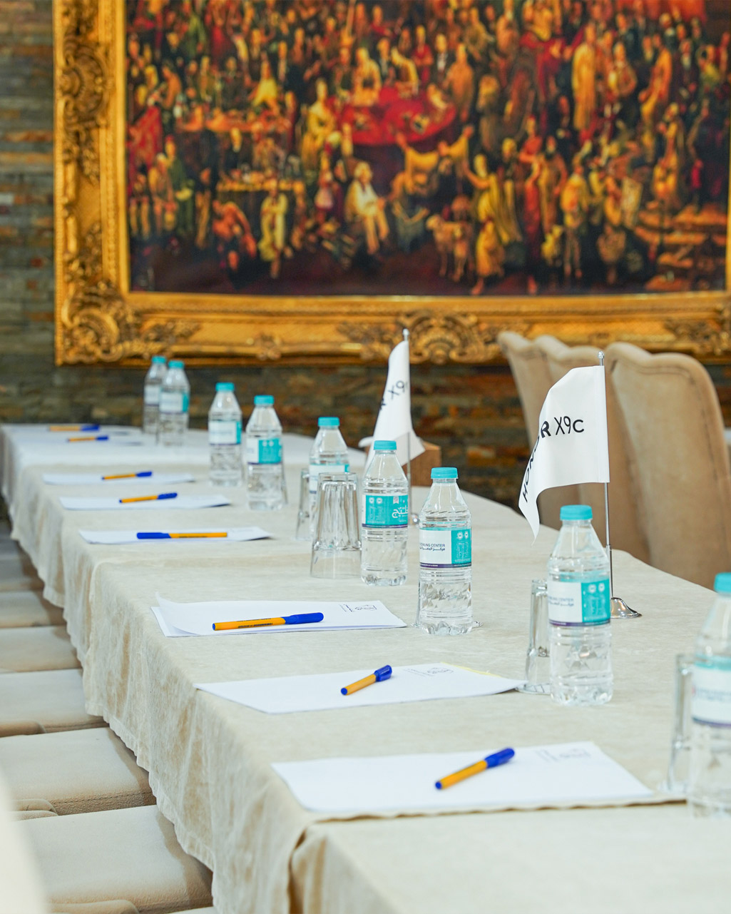 A modern conference room with chairs arranged for a meeting.