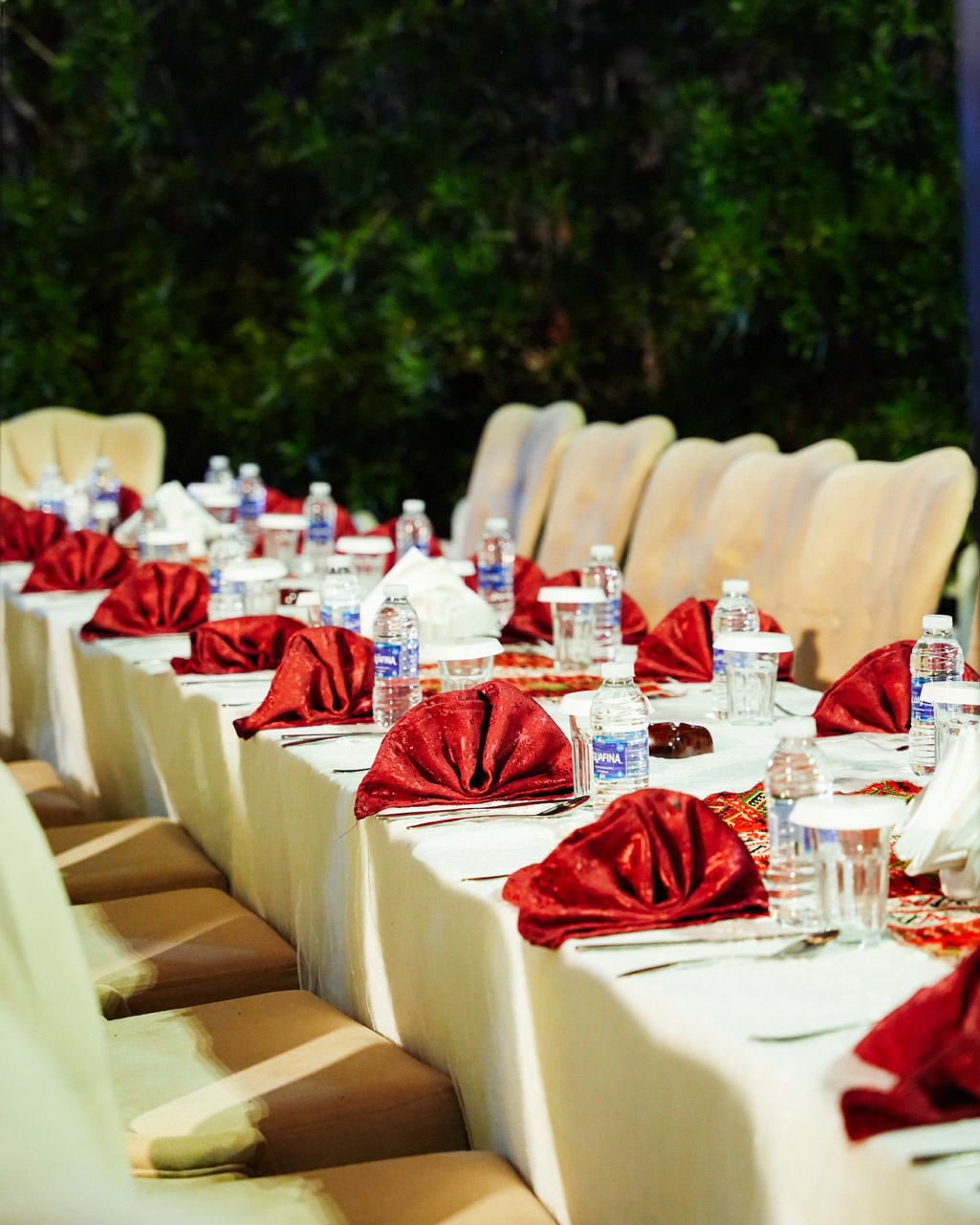 A detailed view of event decor, including floral centerpieces and table settings.